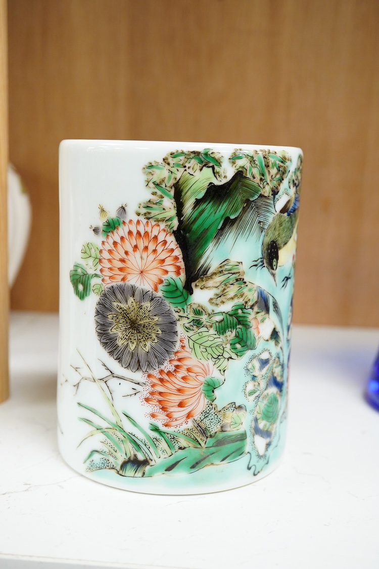A Chinese famille verte cylindrical brush pot, decorated with birds and flowers, 13cm high